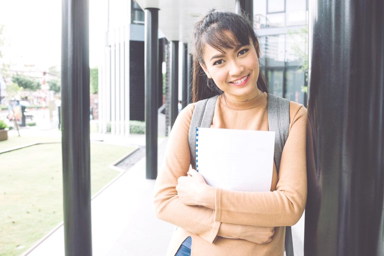 Financial planning consultation workspace with budgeting materials and laptop