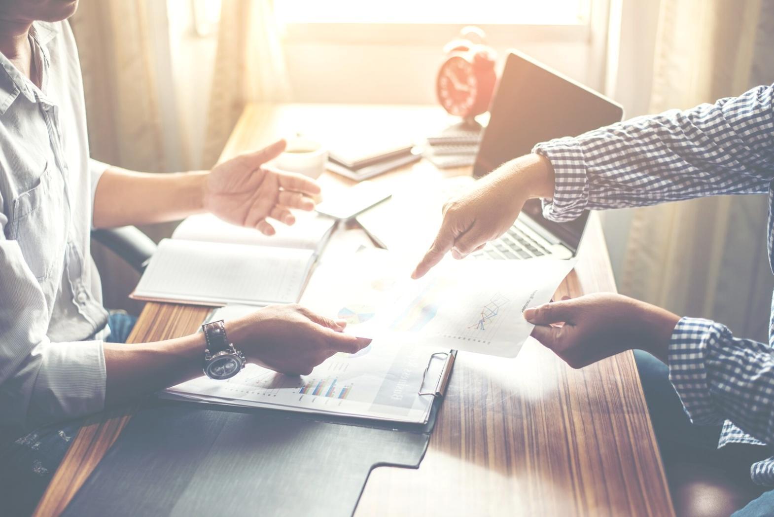 Participant reviewing budget planning materials during workshop session